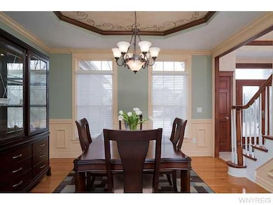 Dining Room. Transom windows and custom blinds all