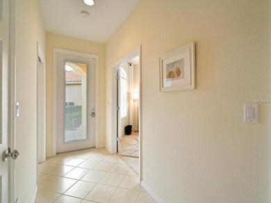 The bright foyer opens up to the den/office