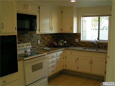 UPDATED KITCHEN  WITH RAISED  GRANITE COUNTERS. GL