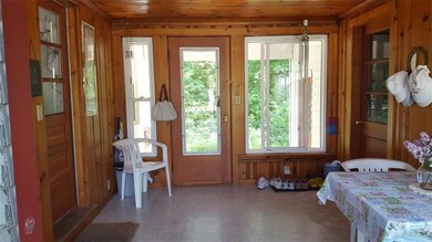 A sunny breezeway accesses the...