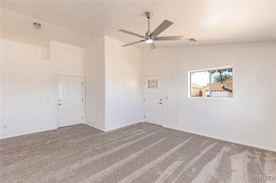 Unfurnished room featuring high vaulted ceiling, c
