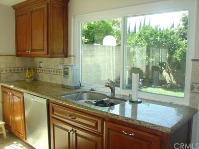 Kitchen has Tumble Tile Backsplash & New Windows