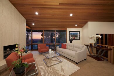 Sunset views are framed by floor-to-ceiling window