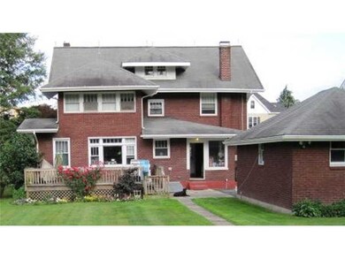 Exterior Back. From the back yard the large home i