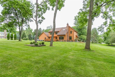 Back view of home and yard