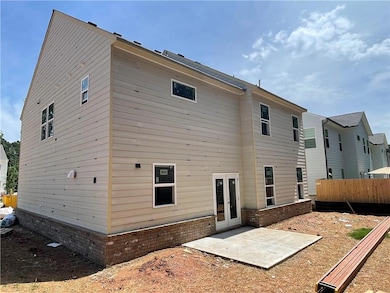 Back of property featuring a patio area, fence, fr
