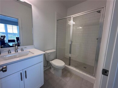 Full Bathroom on ground level with upgraded walk in shower  *Photos are of stagged home. Photos shown are not actual unit.*