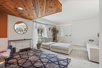 Living room featuring wood-type flooring and woode