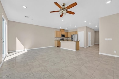 Unfurnished living room with recessed lighting, ceiling fan, and light tile patterned floors