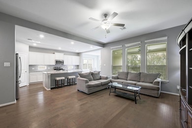 Living area featuring dark wood finished floors, 