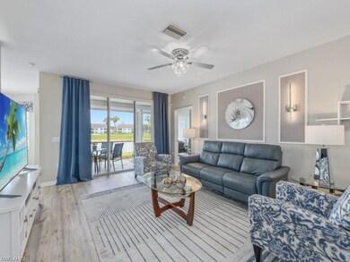 Living room with baseboards, light wood-style floo