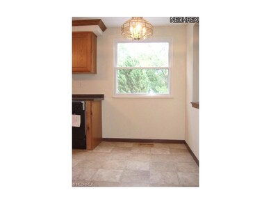The dinette area of the eat-in kitchen overlooks t