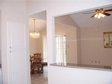 Kitchen. Looking from the kitchen to the living an