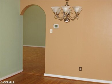 Dining Room - Dining area with wood floor and arch