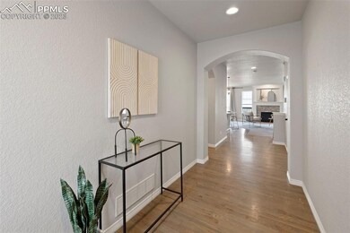 Grand entryway with Oak wood floors and architectu