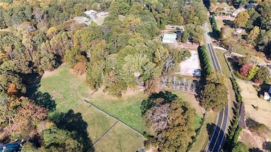 View of property location featuring a forest