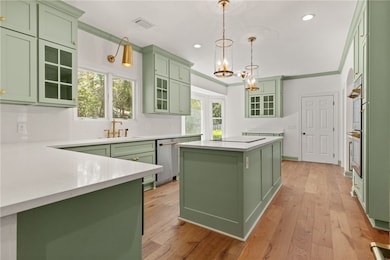 Custom cabinetry pairs with a sprawling island top