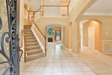 Beautiful entryway that is open to the second floo