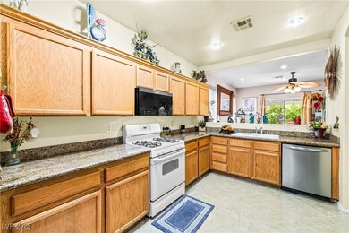 Kitchen featuring dishwasher, white gas range, a s
