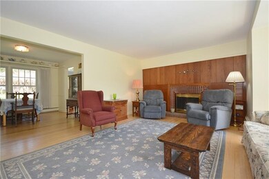 Large Living Room with hardwood floors, open to Di