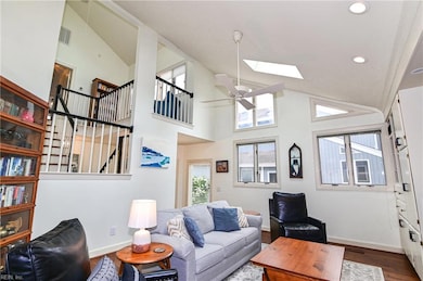 Dramatic family room with soaring ceilings and sky