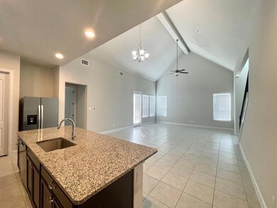 Kitchen with light tile patterned flooring, high vaulted ceiling, a chandelier, beamed ceiling, and stainless steel appliances