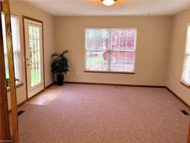Four Season Room with door to private patio.