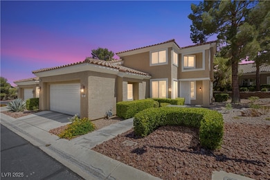 View of front of property with stucco siding, a ti