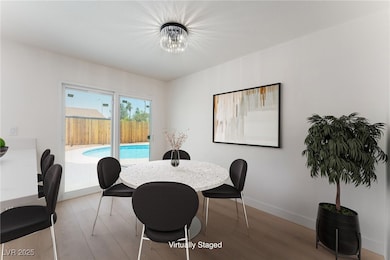 Dining room featuring wood finished floors and a c