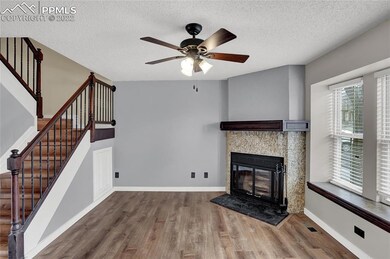 Woodburning fireplace in living room on main level
