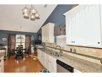 Beautiful wood floors and granite countertops.  Th