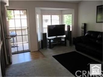 Front entrance with bay window in living room.