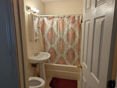 Full bathroom with tile patterned floors and shower / bathtub combination with curtain