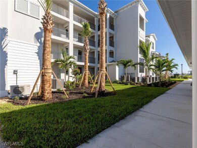 View of apartment building / complex featuring a c