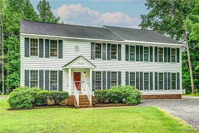Colonial-style house with a front yard