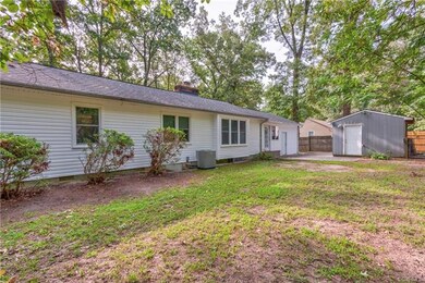 This is the back of the home and you can see the patio off the back door between the garage and the shed.