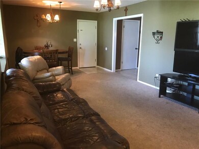 Living room, dining area with access to kitchen ar