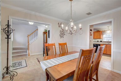 The grand formal dining room is open to the kitchen for ease for entertaining with family/friends.