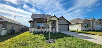 View of front of home featuring a garage and a fro
