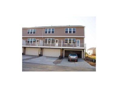 Exterior Back. Two finished car garage attached with keyless entry.