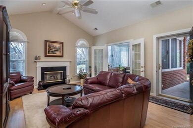 Family room with gas-log fireplace.