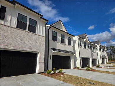 View of front of house featuring concrete driveway, brick siding, a residential view, an attached garage, and board and batten siding
