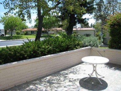 Sunny patio that backs up to a green belt.