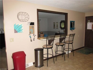 Breakfast bar and opening into livingroom.