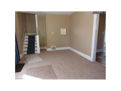 Living room. New carpet. Entry to dining room and 