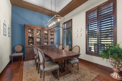 Dining area featuring a chandelier, baseboards, a