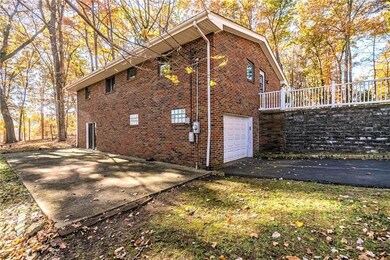 Huge cement back patio, long driveway and single c
