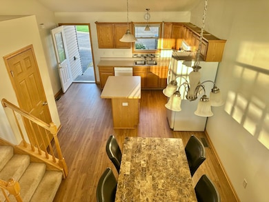 A birds eye view of the kitchen from the living room one level up.