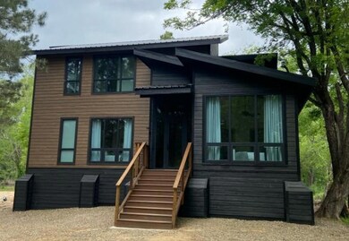 View of front facade with metal roof