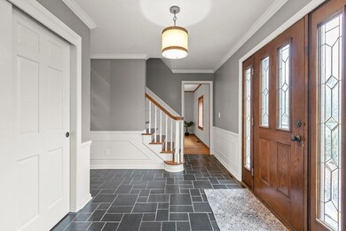 Open foyer w/slate flooring